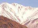 Brilliant snowy peaks! Must be cold up there with all that snow blowing off the peaks.